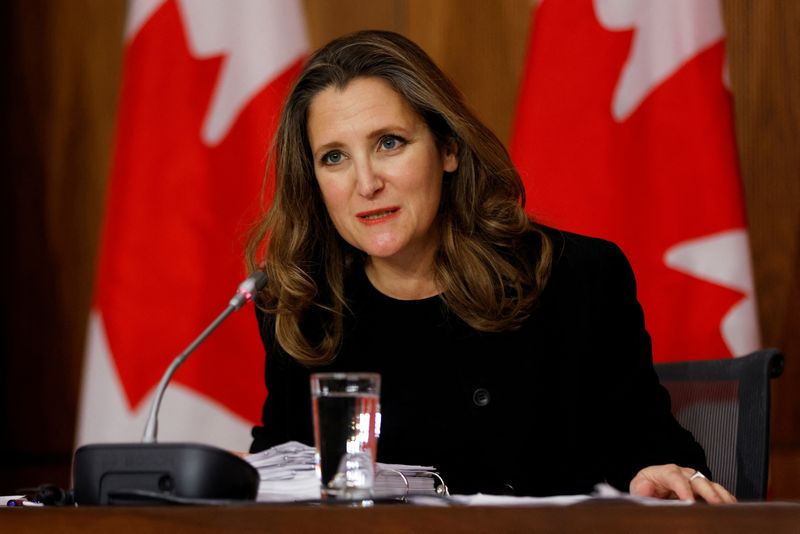 © Reuters. FILE PHOTO: Canada's Deputy Prime Minister and Minister of Finance Chrystia Freeland speaks to news media before unveiling her first fiscal update, the Fall Economic Statement 2020, in Ottawa, Ontario, Canada November 30, 2020. REUTERS/Blair Gable/File Photo