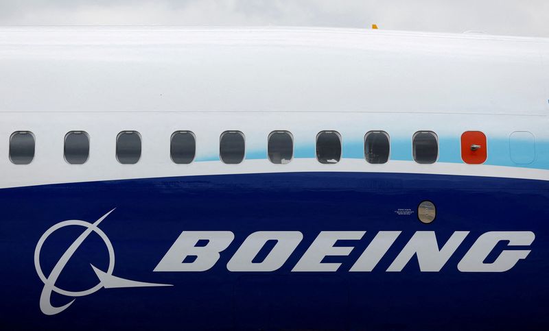 © Reuters. FILE PHOTO: The Boeing logo is seen on the side of a Boeing 737 MAX at the Farnborough International Airshow, in Farnborough, Britain, July 20, 2022.  REUTERS/Peter Cziborra/File Photo